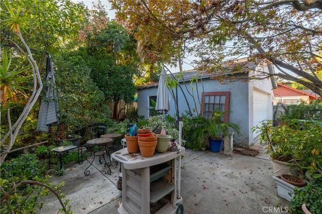 a view of a backyard with sitting area