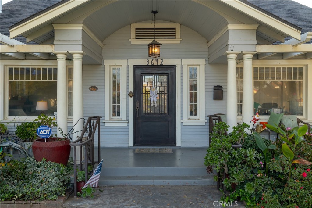 3642 Larchwood Place Riverside, CA 92506 - Photo 6 of 35 a front view of a house with a yard