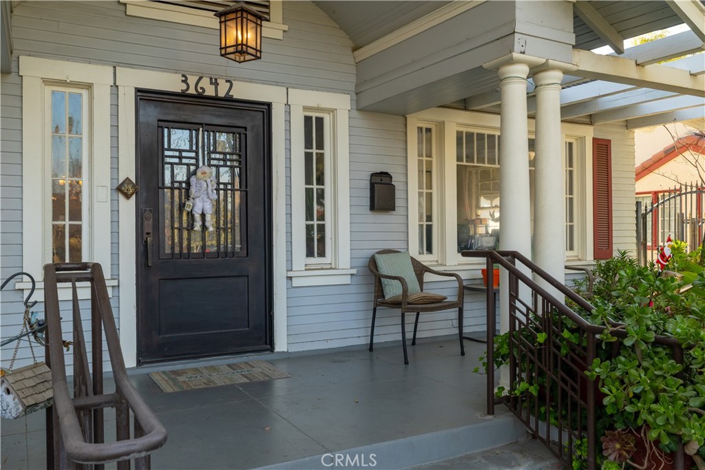 3642 Larchwood Place Riverside, CA 92506 - Photo 7 of 35 a view of a porch with a table and chairs and potted plants