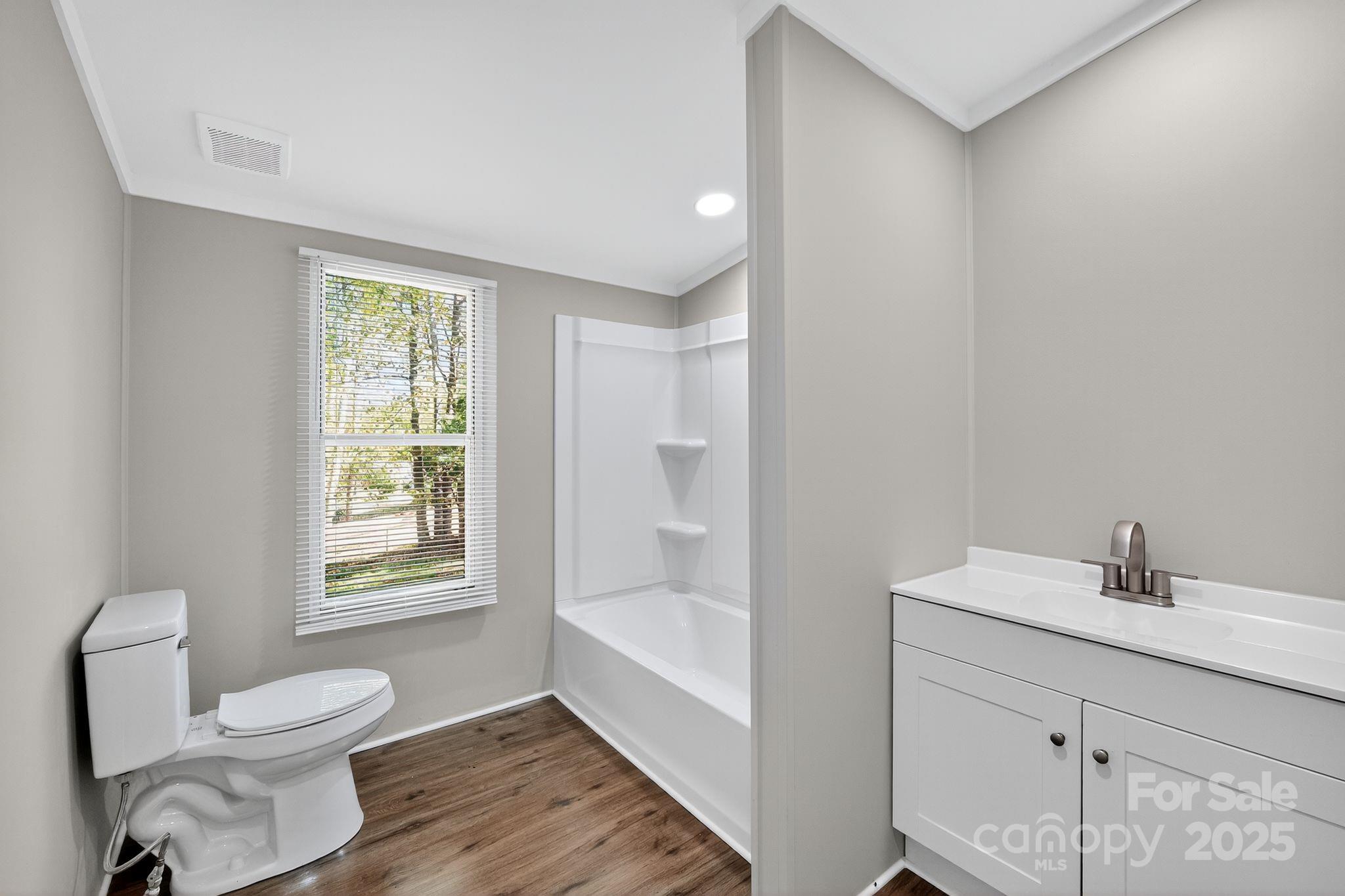 3802 Hickory Grove Road Mount Holly, NC 28120 - Photo 13 of 15 a bathroom with a sink toilet and shower