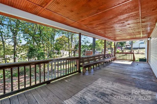 a view of a porch with wooden floor