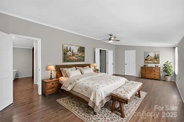 a bedroom with a bed and a table in it