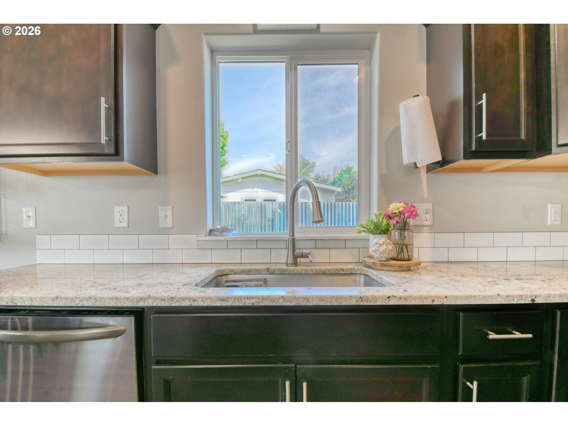 233 East Jefferson Street Athena, OR 97813 - Photo 13 of 36 a kitchen with granite countertop a sink and cabinets