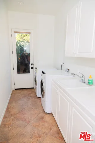 a living room with fireplace furniture and a flat screen tv