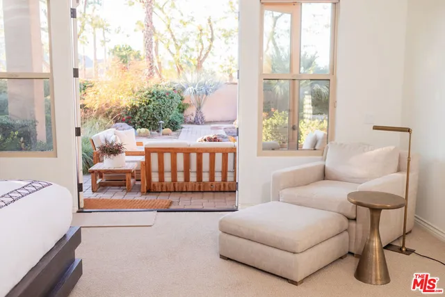 a view of a patio with a dining table and chairs