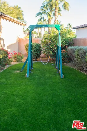 a view of a park with large trees