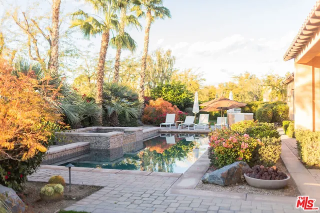 a view of a dining room with furniture and a window