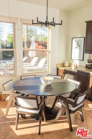 a dining room view with a table and chairs