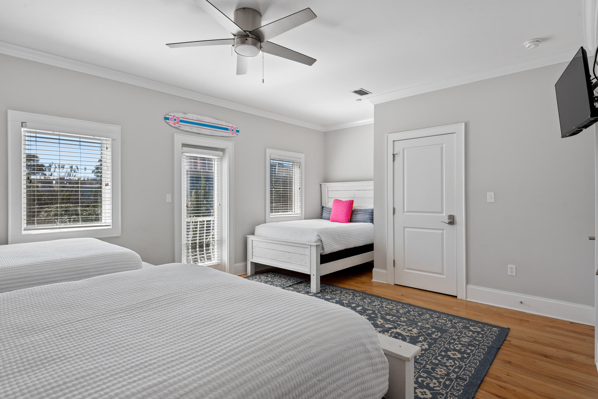 29 Coastal Grove Way, Unit 2 Santa Rosa Beach, FL 32459 - Photo 22 of 56 a bedroom with a bed and wooden floor