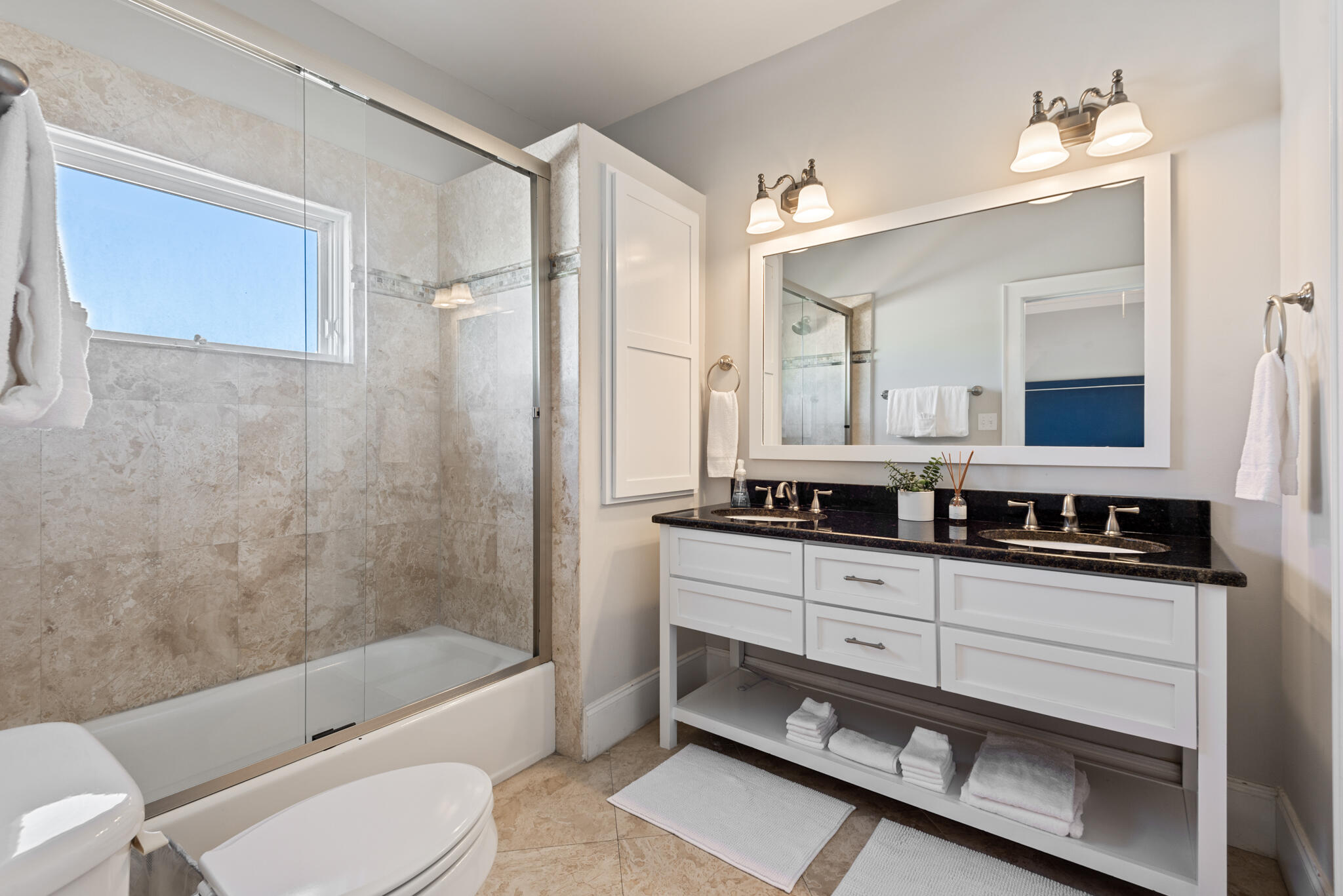 29 Coastal Grove Way, Unit 2 Santa Rosa Beach, FL 32459 - Photo 29 of 56 a bathroom with a double vanity sink a toilet a mirror and bathtub