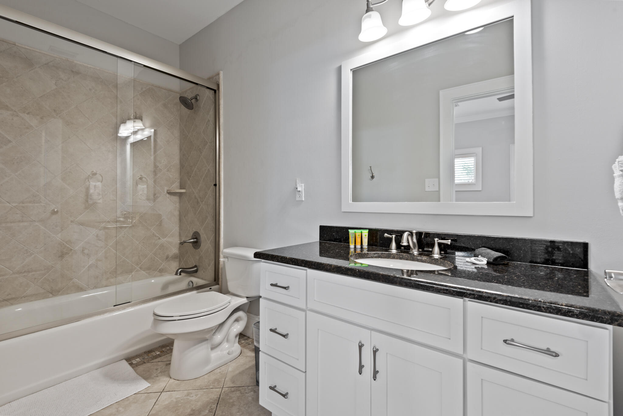 29 Coastal Grove Way, Unit 2 Santa Rosa Beach, FL 32459 - Photo 34 of 56 a bathroom with a granite countertop sink mirror vanity and toilet