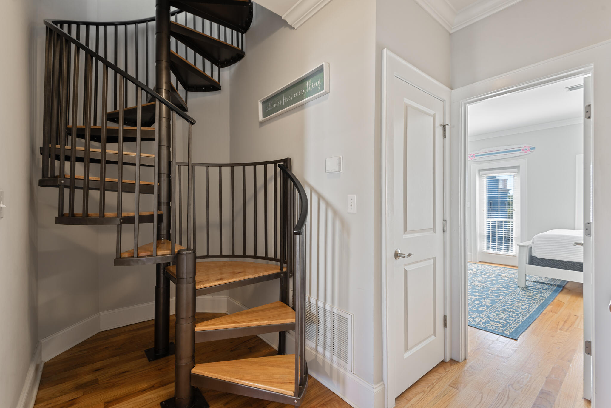 29 Coastal Grove Way, Unit 2 Santa Rosa Beach, FL 32459 - Photo 39 of 56 a view of a hallway with wooden floor and entryway