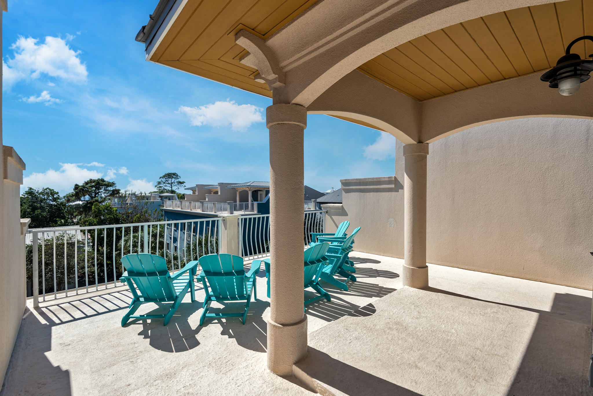 29 Coastal Grove Way, Unit 2 Santa Rosa Beach, FL 32459 - Photo 43 of 56 a view of a chair and tables in the patio
