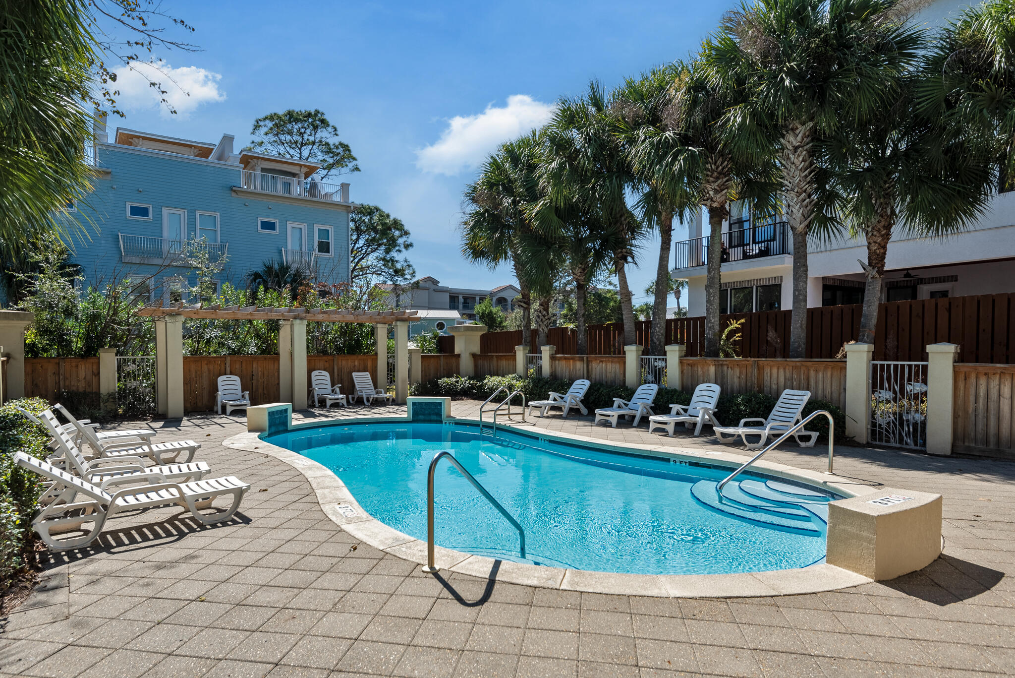 29 Coastal Grove Way, Unit 2 Santa Rosa Beach, FL 32459 - Photo 47 of 56 a view of a swimming pool with chairs in patio