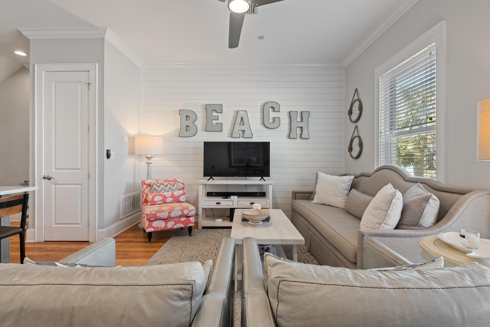 29 Coastal Grove Way, Unit 2 Santa Rosa Beach, FL 32459 - Photo 5 of 56 a living room with furniture and a flat screen tv