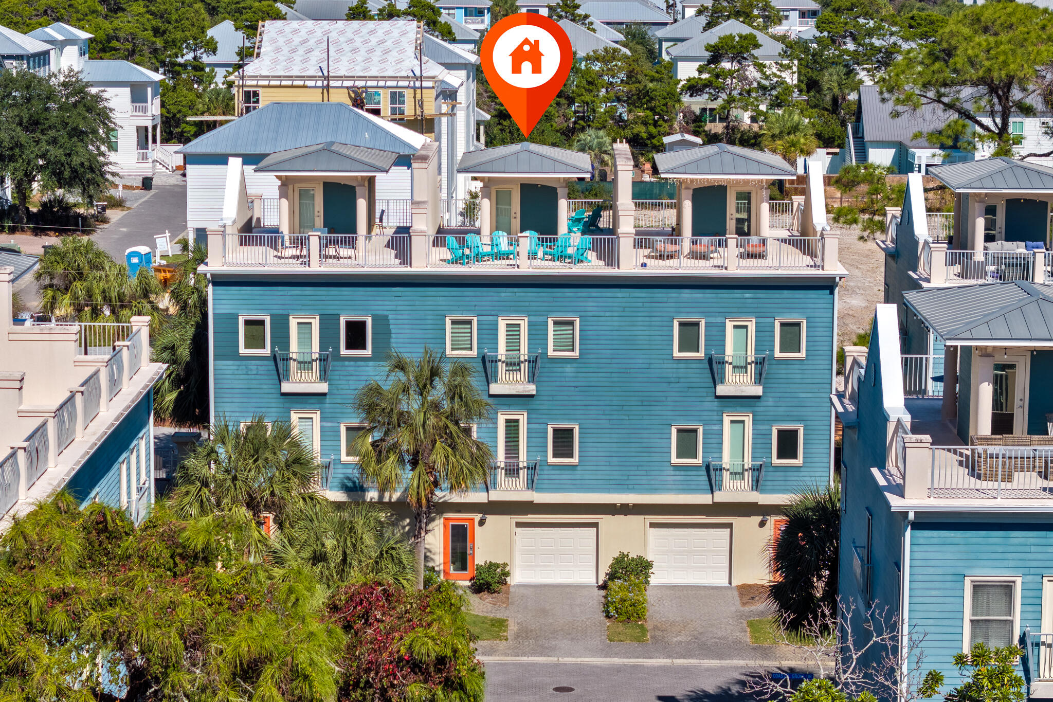 29 Coastal Grove Way, Unit 2 Santa Rosa Beach, FL 32459 - Photo 55 of 56 a view of a building with a lot of windows and flowers