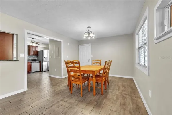a kitchen with a stove a sink and a refrigerator