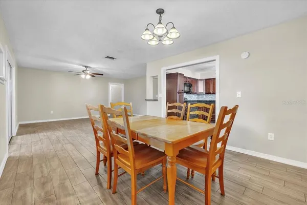 a kitchen with stainless steel appliances granite countertop a stove a sink dishwasher and a microwave oven with cabinets