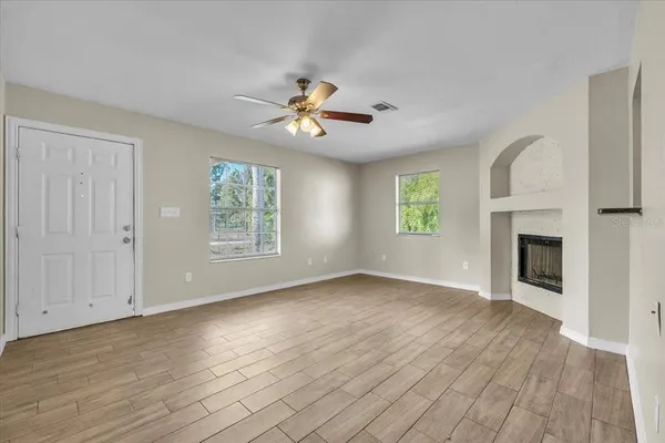 a view of an empty room with glass door