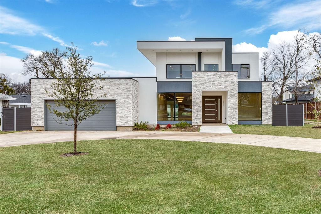 a house with sign broad in front of it