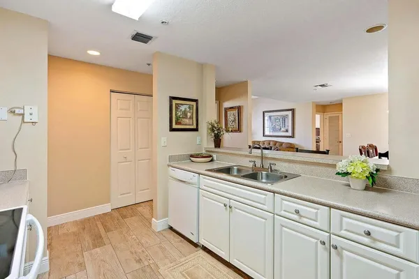 a kitchen with a sink and cabinets