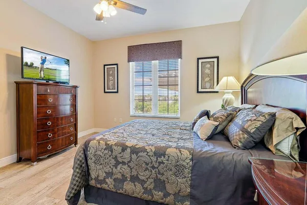 a bedroom with a bed and a dresser