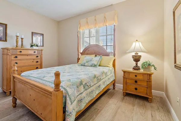 a bedroom with a bed and a dresser