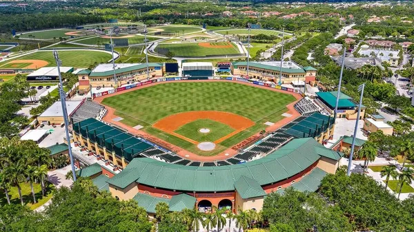 an aerial view of a pool a yard swimming pool and outdoor seating