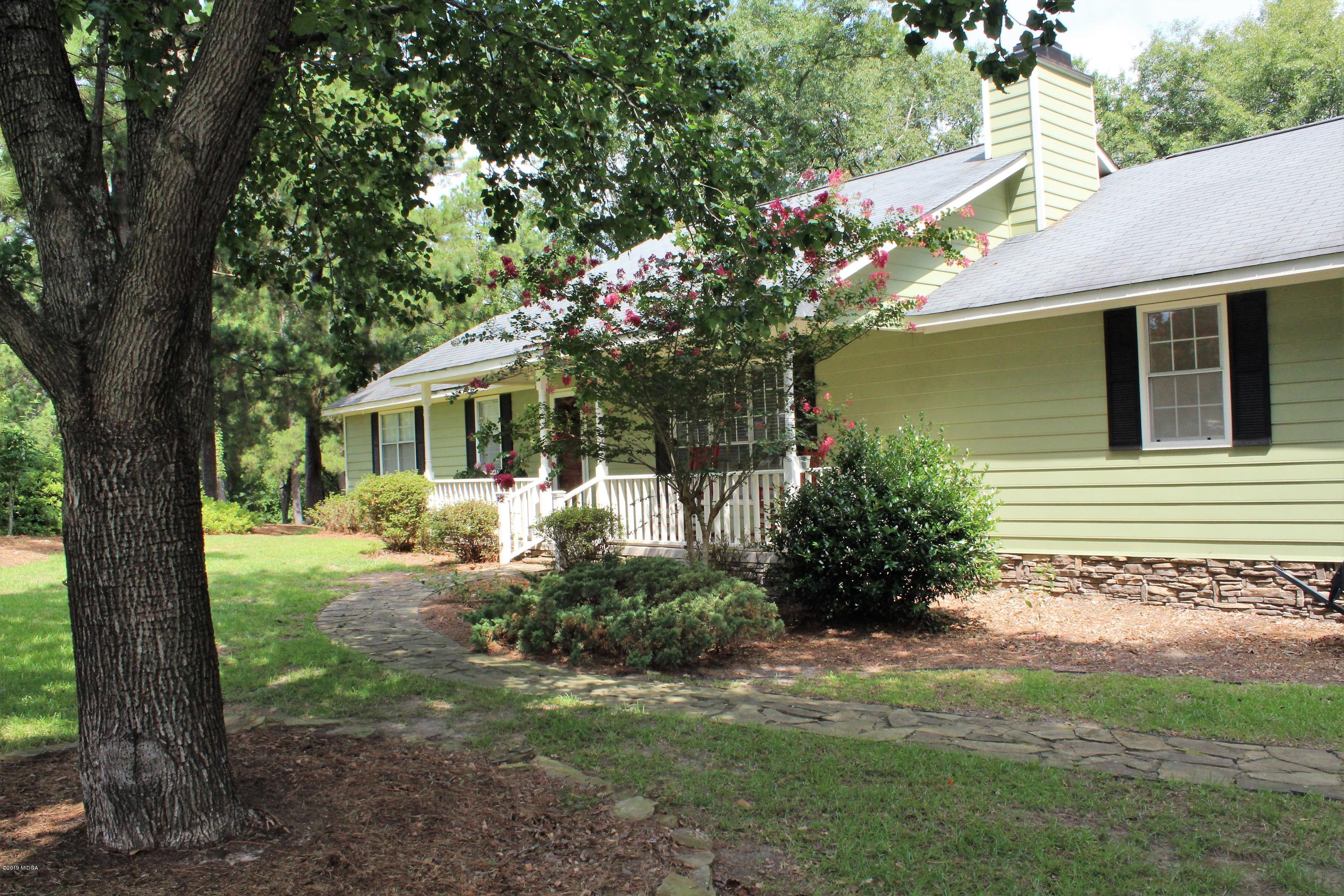 139 Bone Creek Road Macon, GA 31211 - Photo 1 of 18 a front view of a house with garden