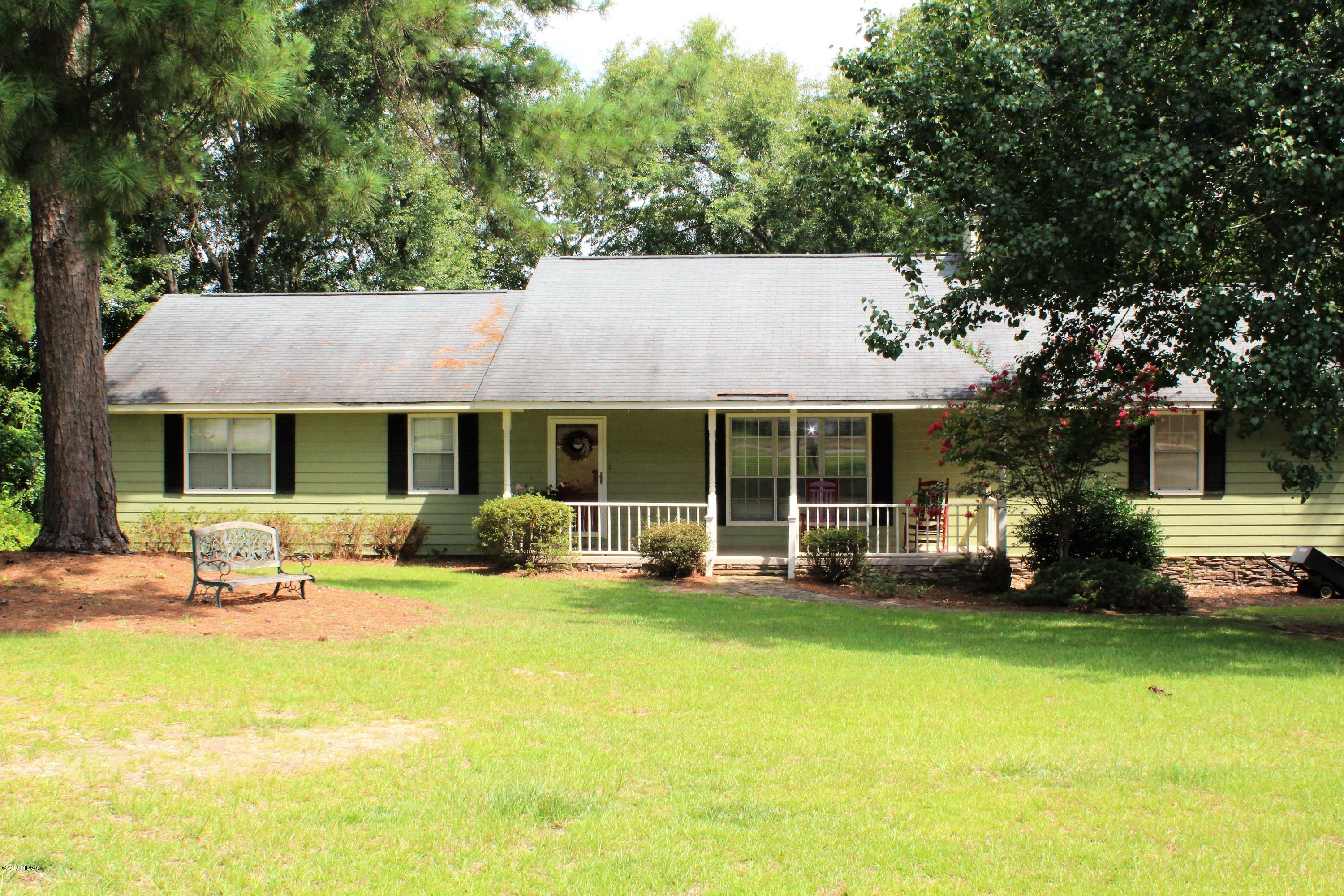 139 Bone Creek Road Macon, GA 31211 - Photo 2 of 18 a front view of a house with a garden and porch