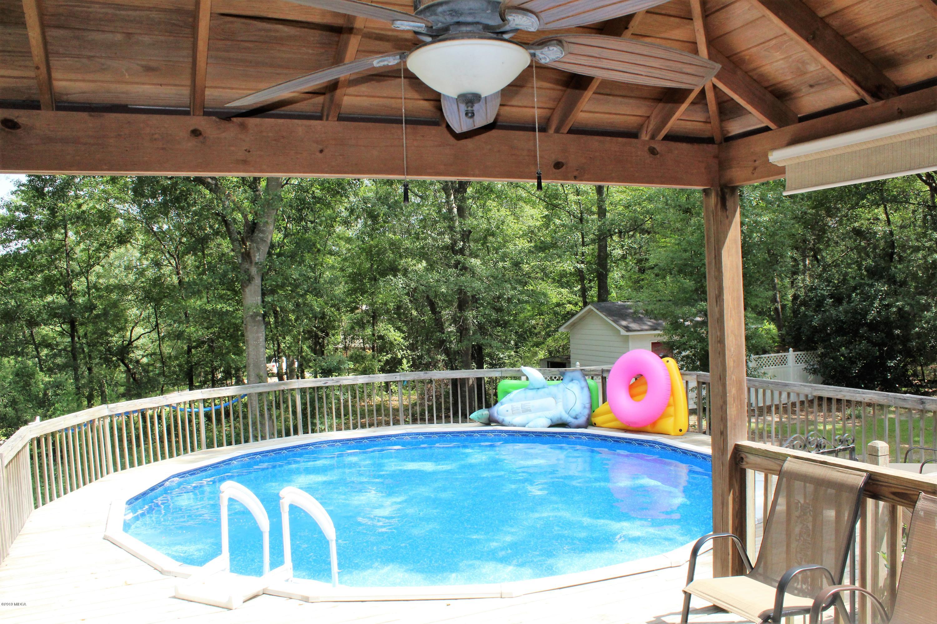 139 Bone Creek Road Macon, GA 31211 - Photo 14 of 18 a view of a swimming pool with a patio