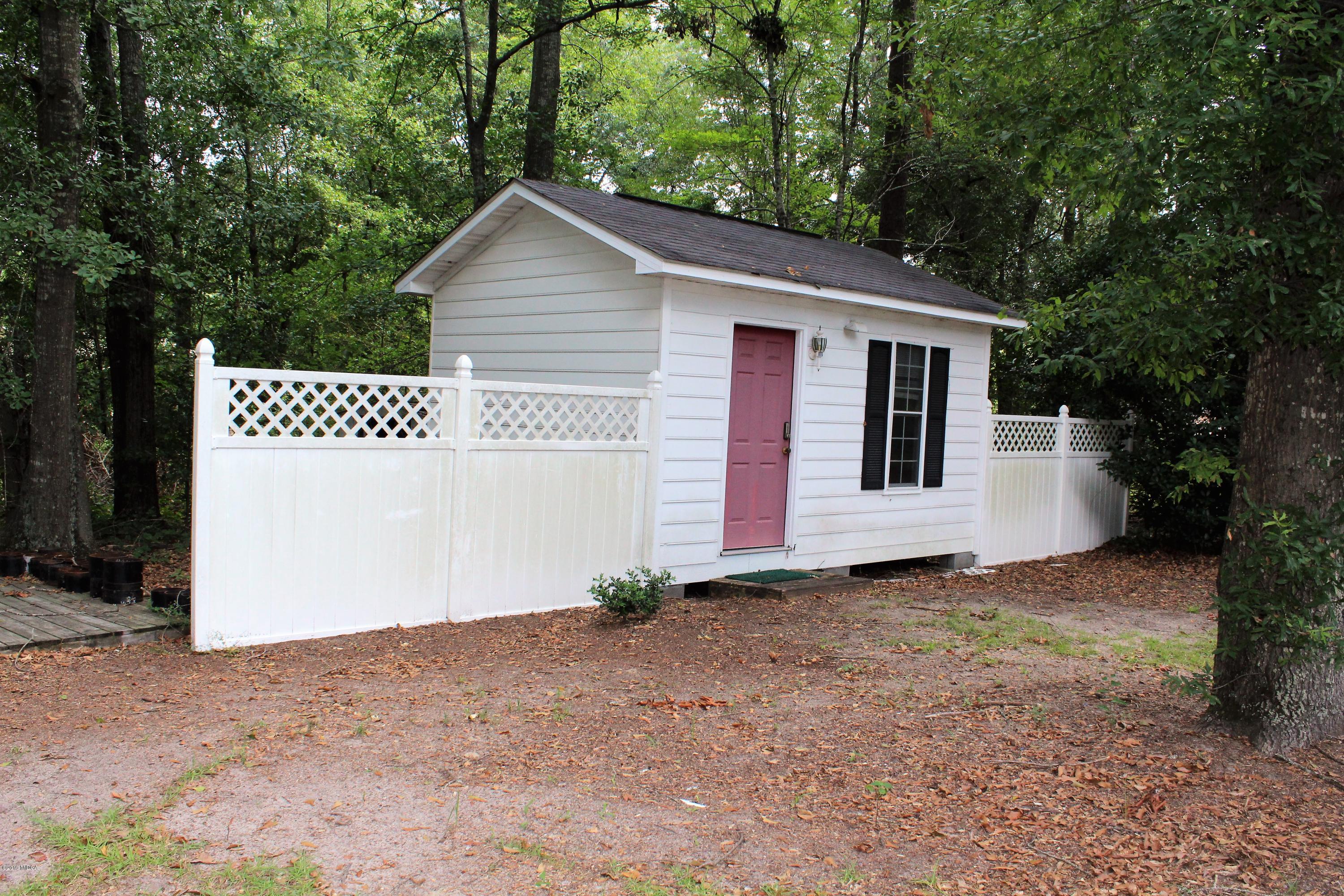 139 Bone Creek Road Macon, GA 31211 - Photo 17 of 18 a view of a house with a yard and garage