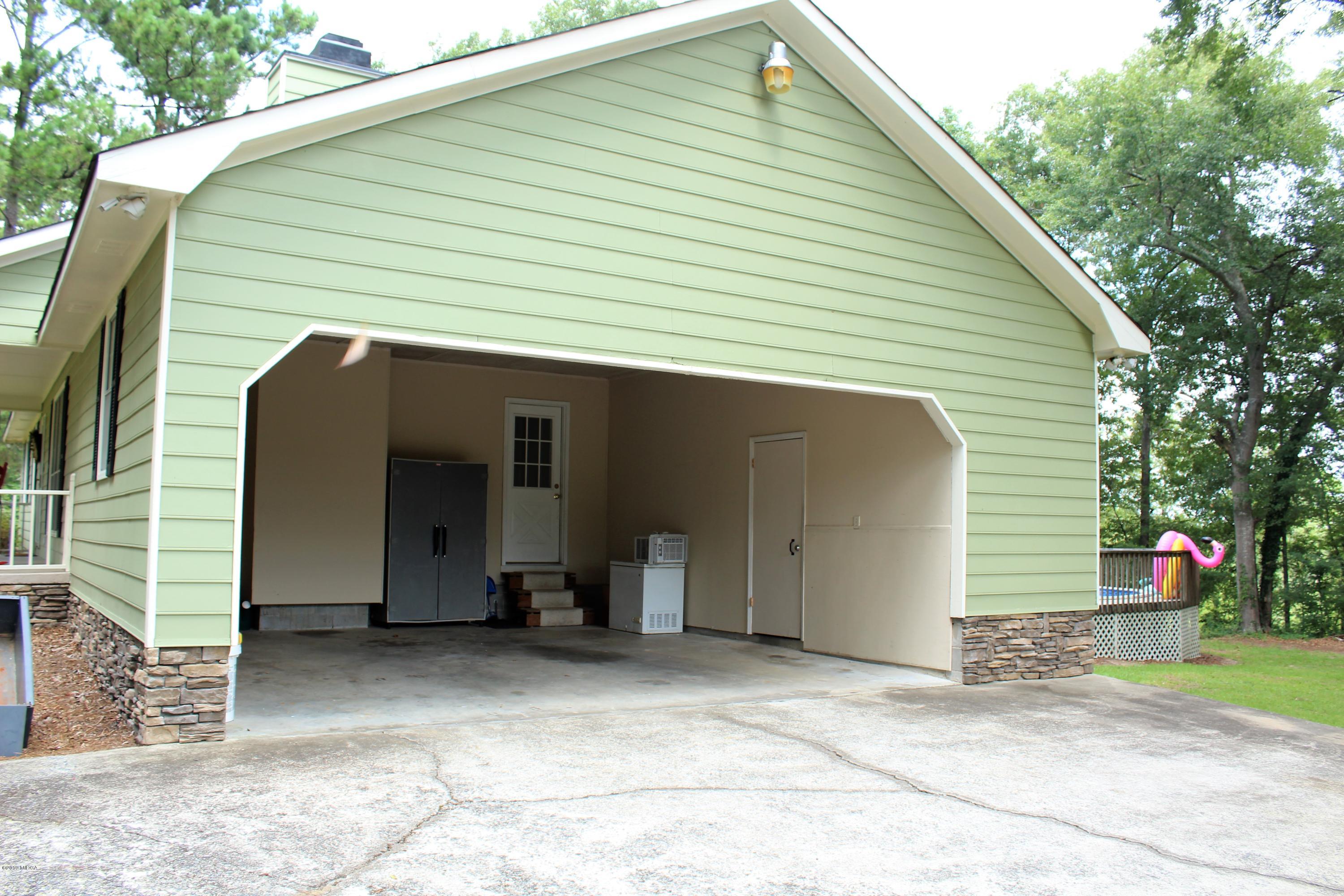 139 Bone Creek Road Macon, GA 31211 - Photo 18 of 18 a view of a house with backyard