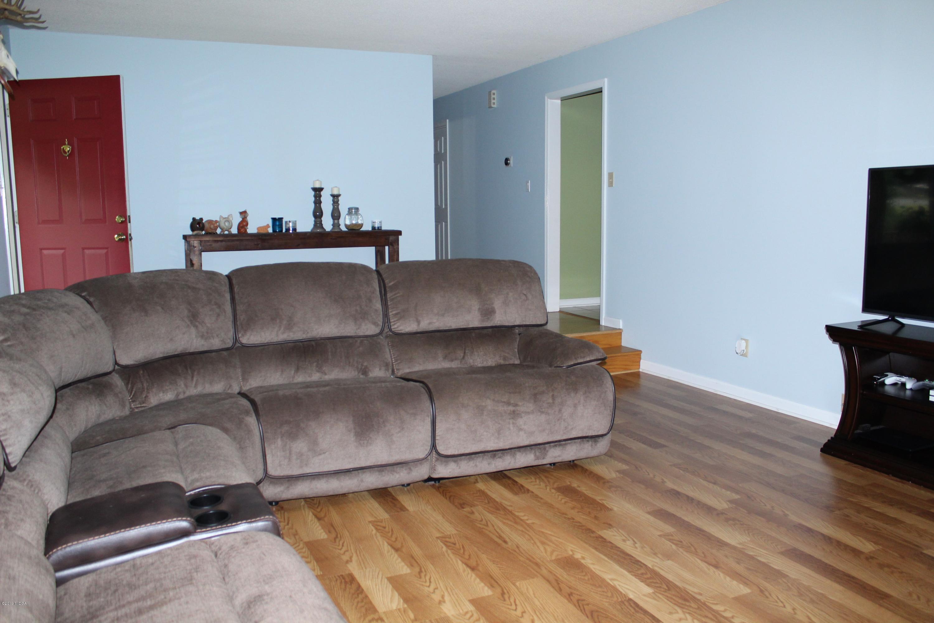 139 Bone Creek Road Macon, GA 31211 - Photo 4 of 18 a living room with furniture and a flat screen tv