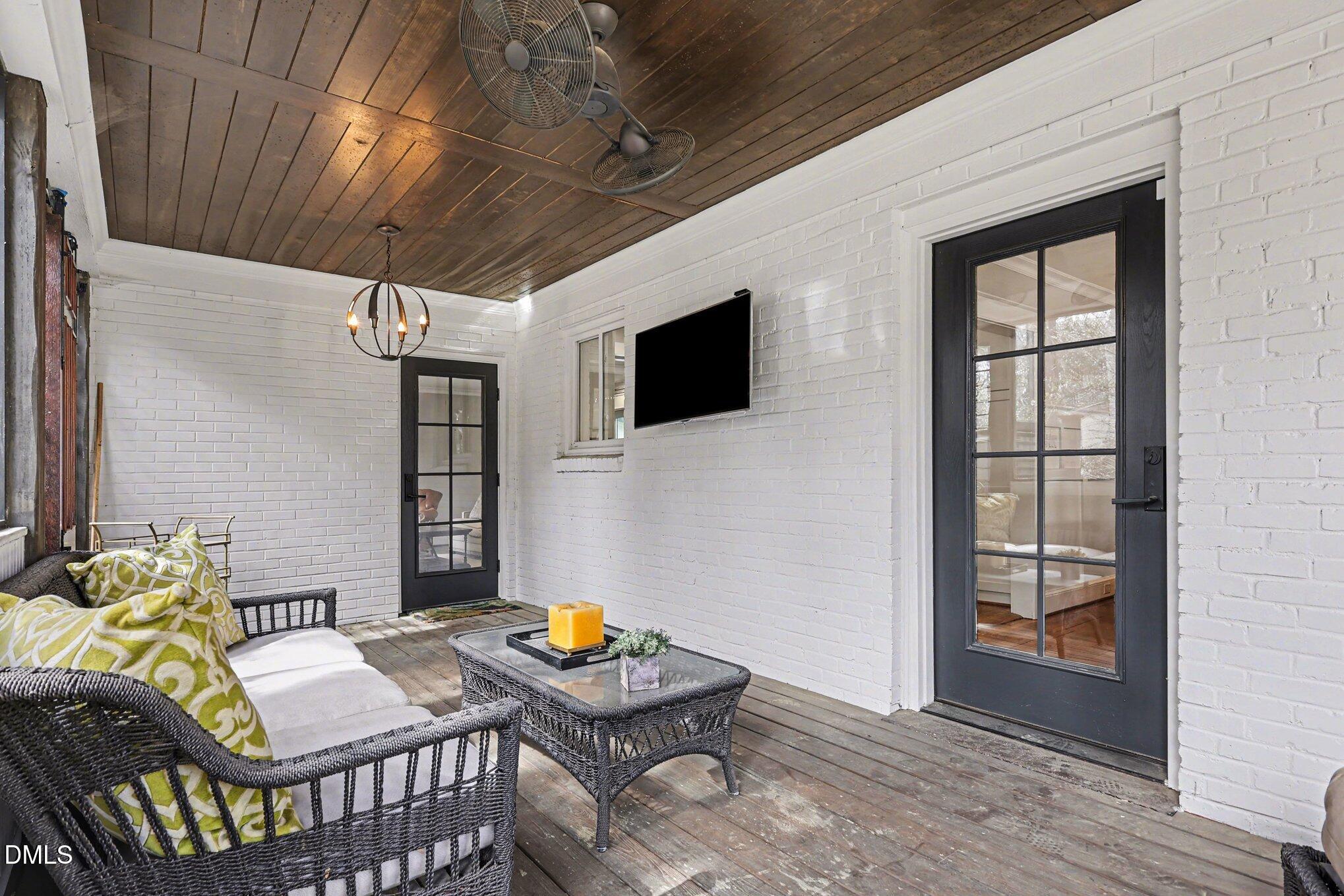 227 Furches Street Raleigh, NC 27607 - Photo 13 of 26 a bedroom with furniture and a window