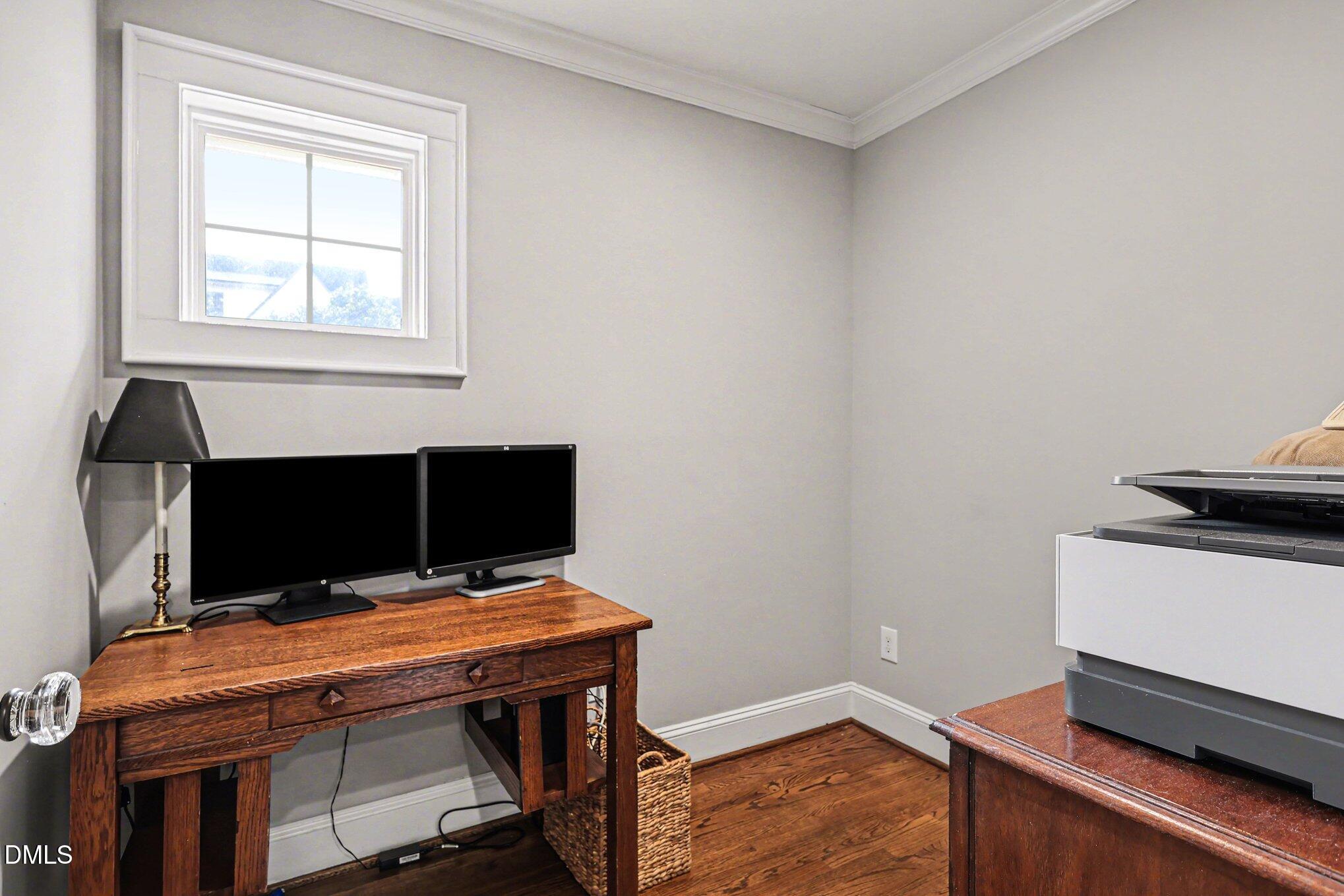 227 Furches Street Raleigh, NC 27607 - Photo 15 of 26 a room with furniture and wooden floor