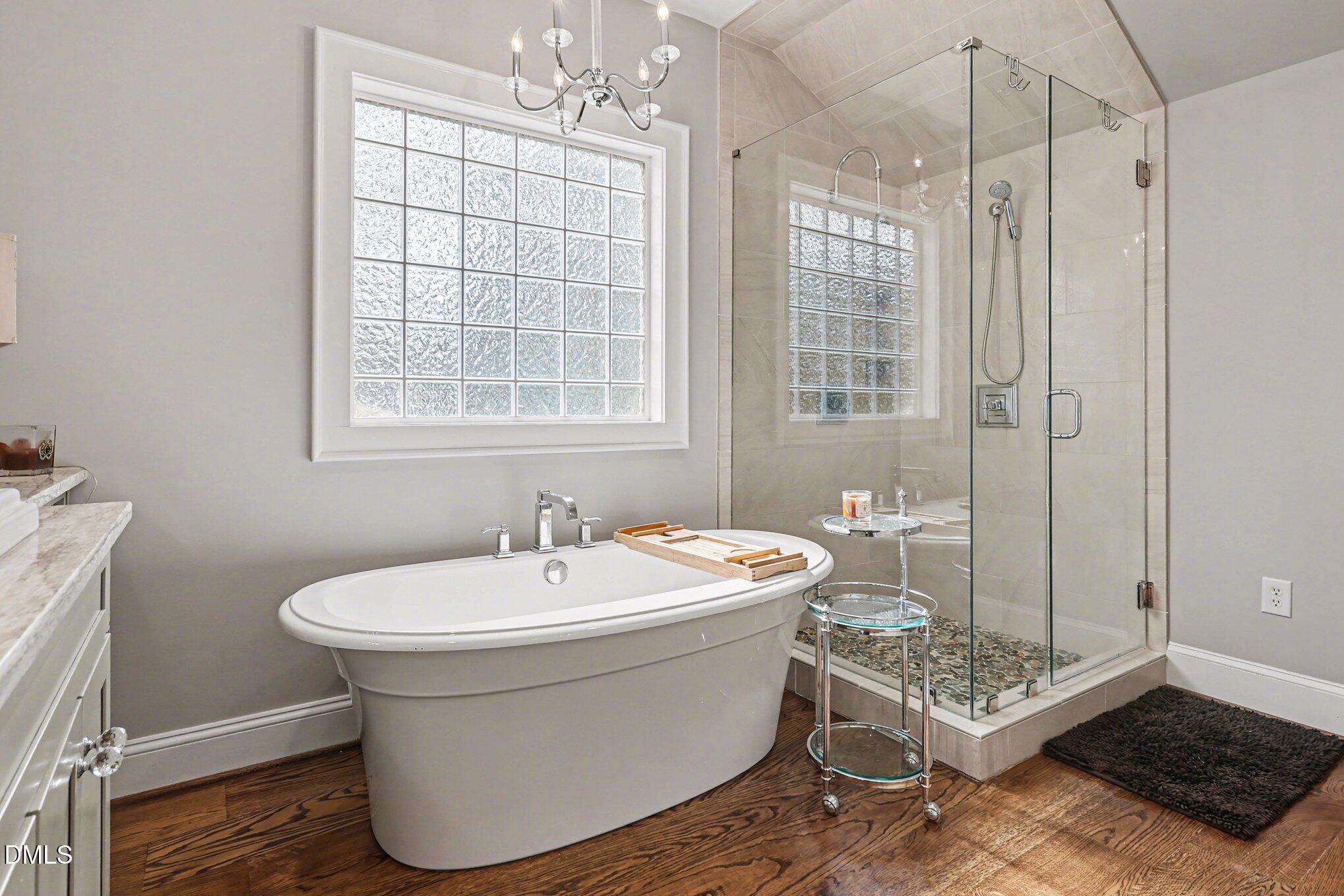 227 Furches Street Raleigh, NC 27607 - Photo 20 of 26 a spacious bathroom with sink shower and mirror