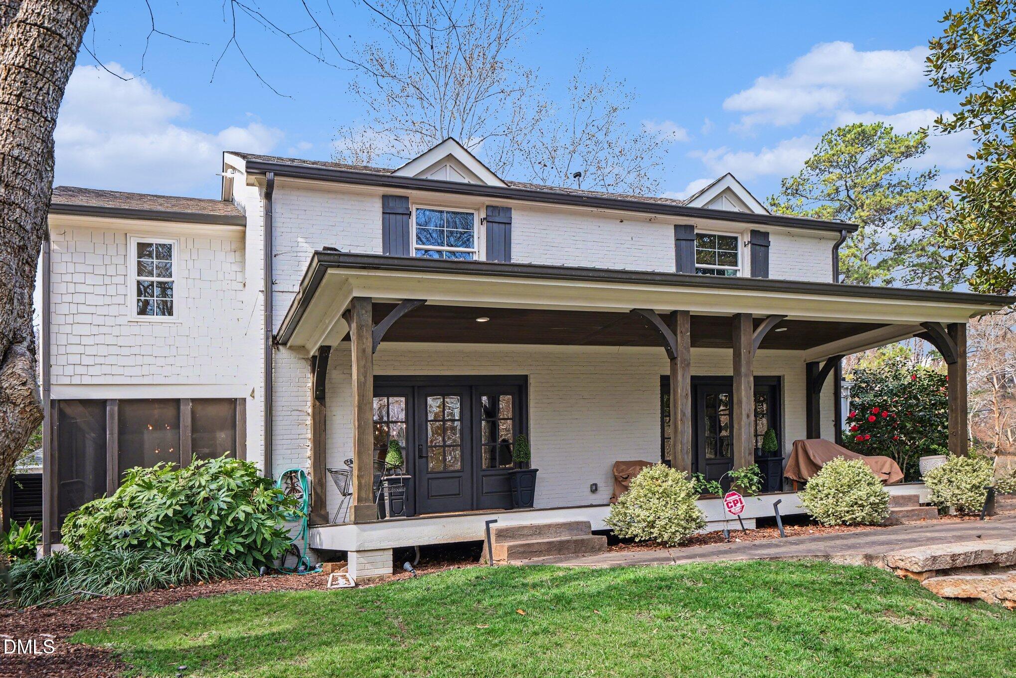 227 Furches Street Raleigh, NC 27607 - Photo 2 of 26 a front view of a house with garden