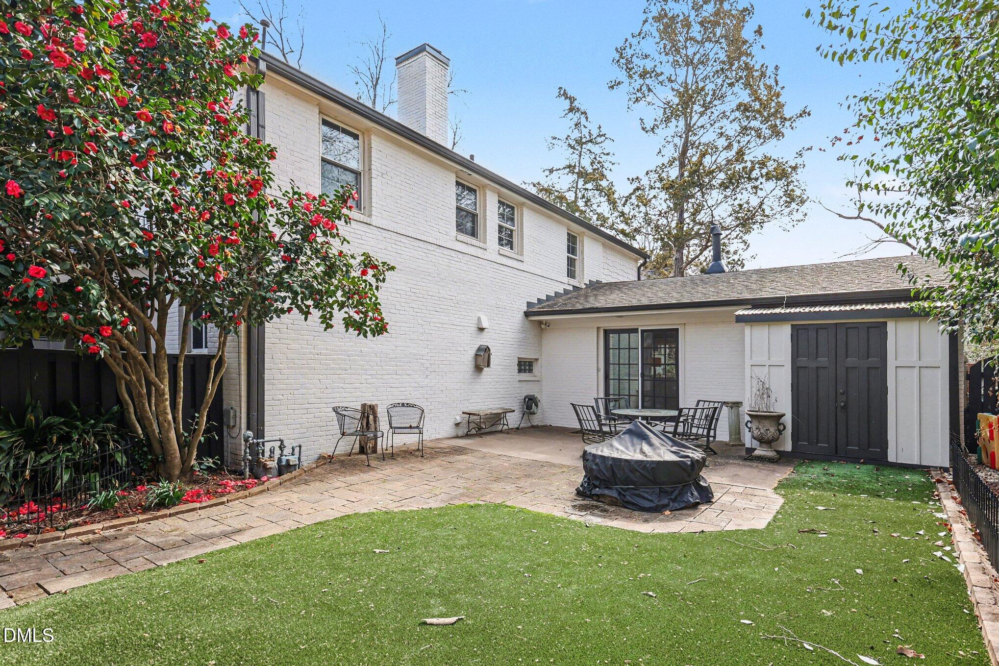 227 Furches Street Raleigh, NC 27607 - Photo 26 of 26 a view of a chair and table in backyard of the house
