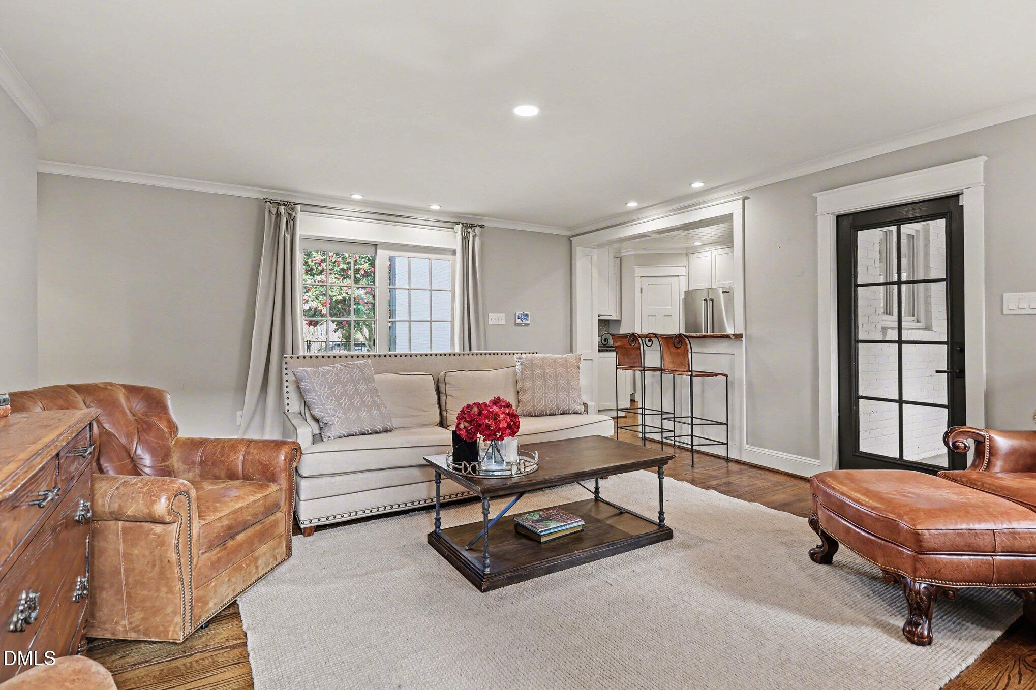 227 Furches Street Raleigh, NC 27607 - Photo 6 of 26 a living room with furniture and a window