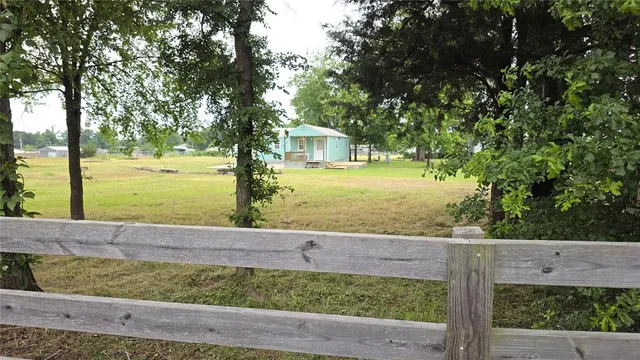 a view of a yard with an outdoor space