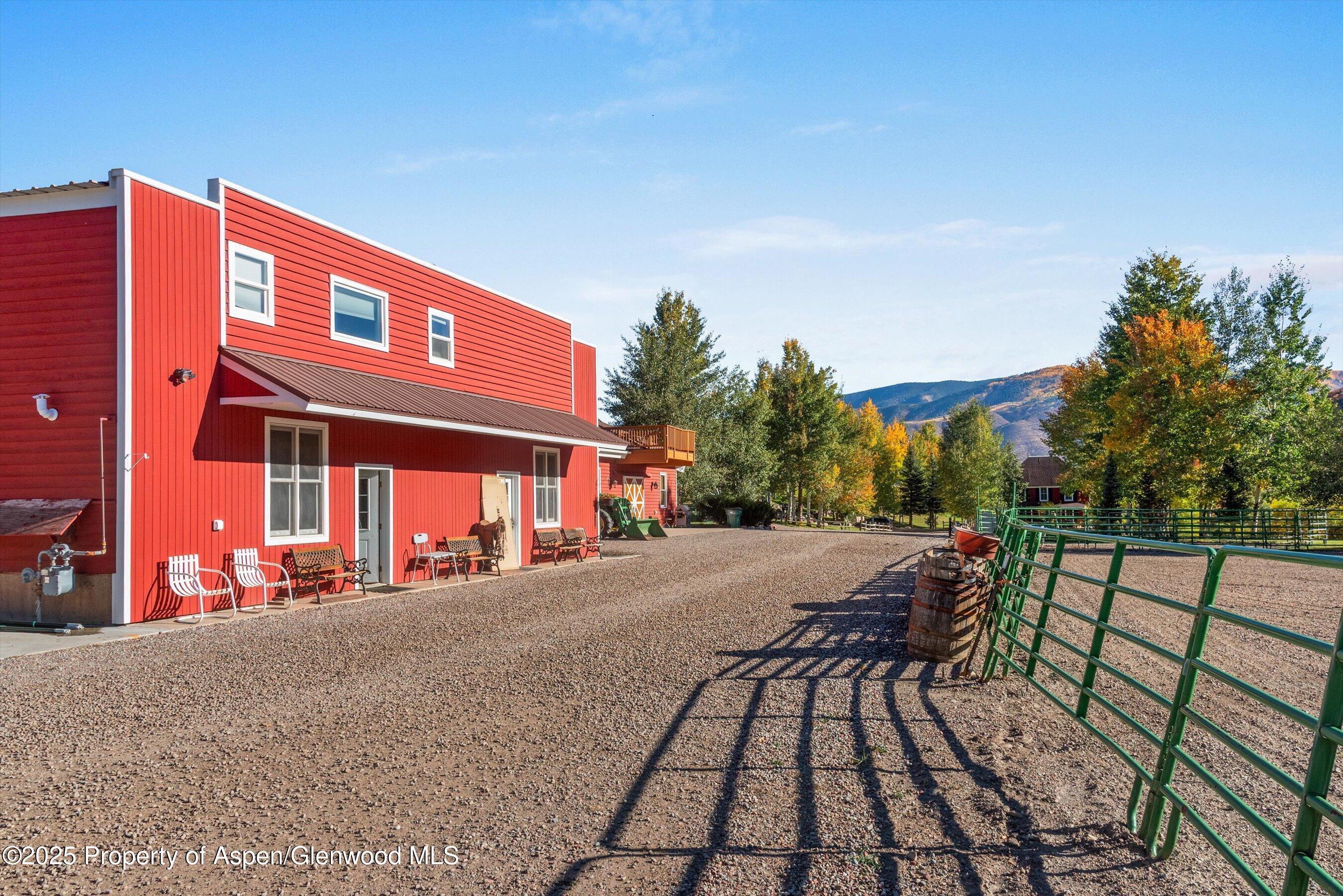 660 Brush Creek Road Aspen, CO 81611 - Photo 13 of 27 a view of a building with backyard and sitting area