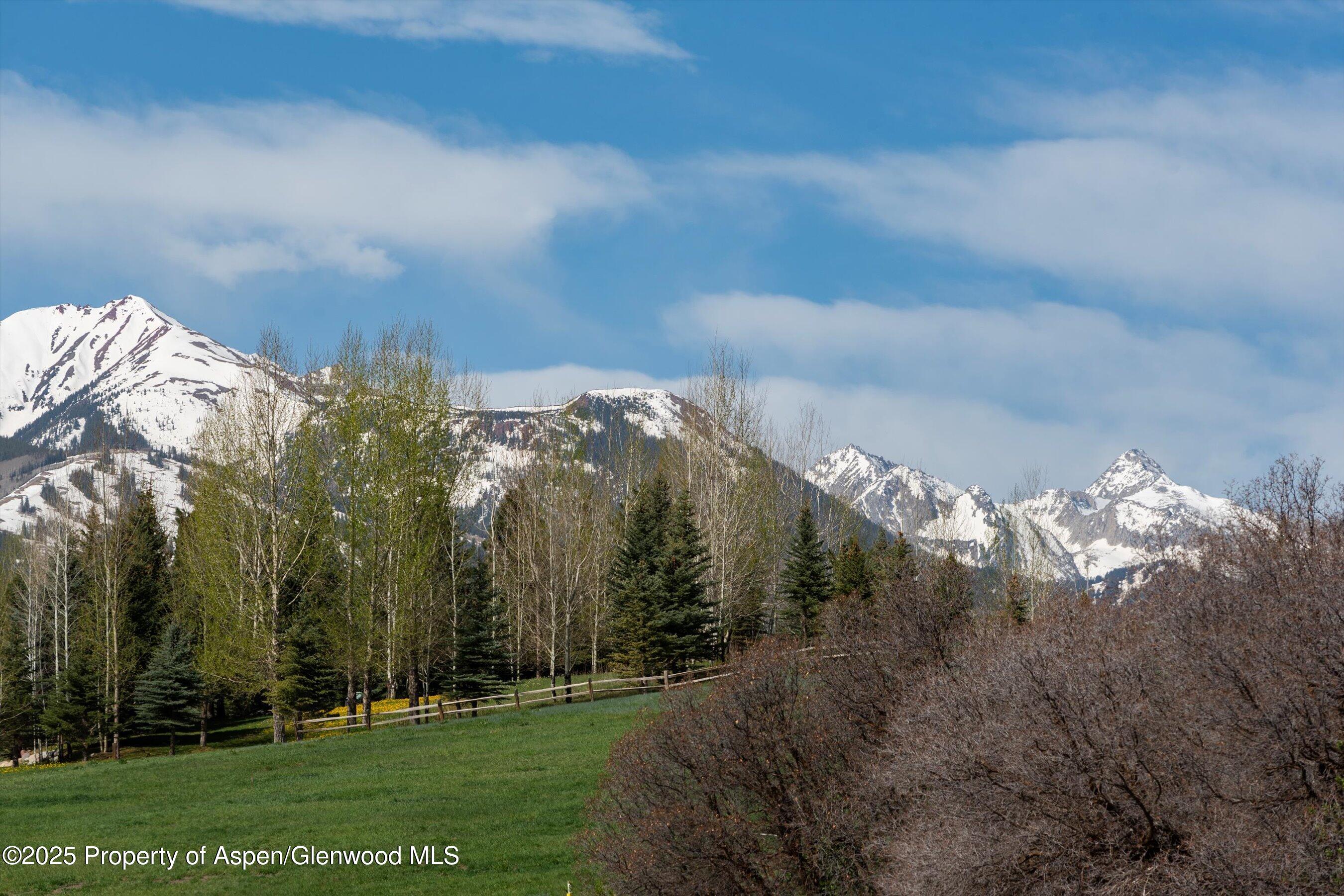 660 Brush Creek Road Aspen, CO 81611 - Photo 23 of 27 a view of a city with lush green forest