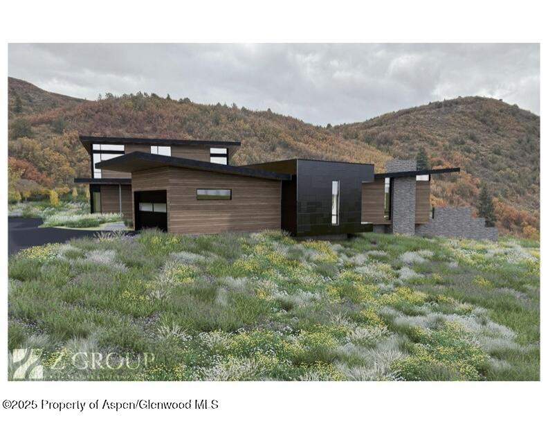 660 Brush Creek Road Aspen, CO 81611 - Photo 26 of 27 a view of a house with a yard