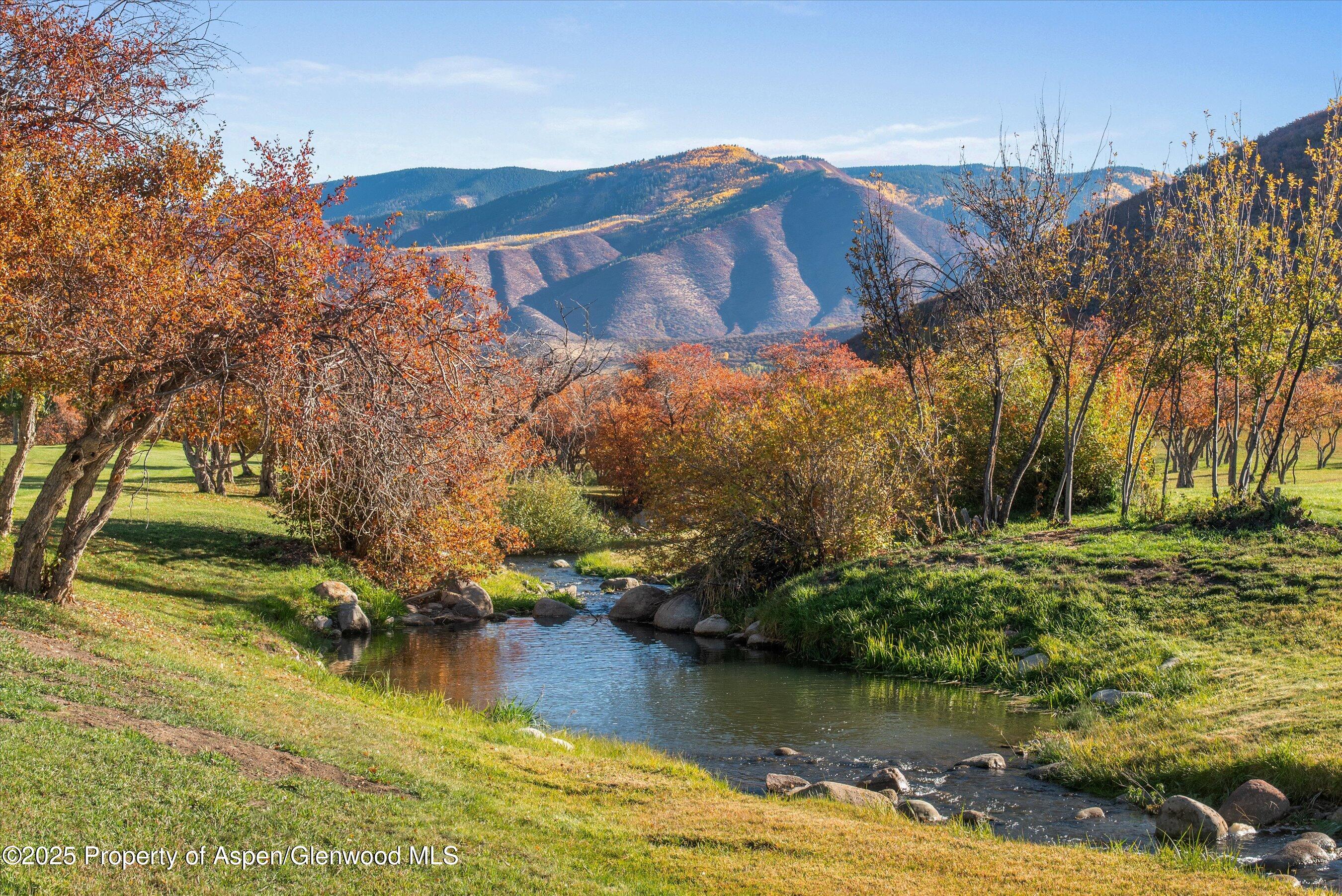 660 Brush Creek Road Aspen, CO 81611 - Photo 3 of 27 a view of a lake with houses