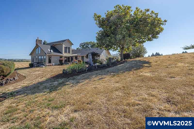 11660 Simpson Road Monmouth, OR 97361 - Photo 49 of 50 a front view of a house with a yard