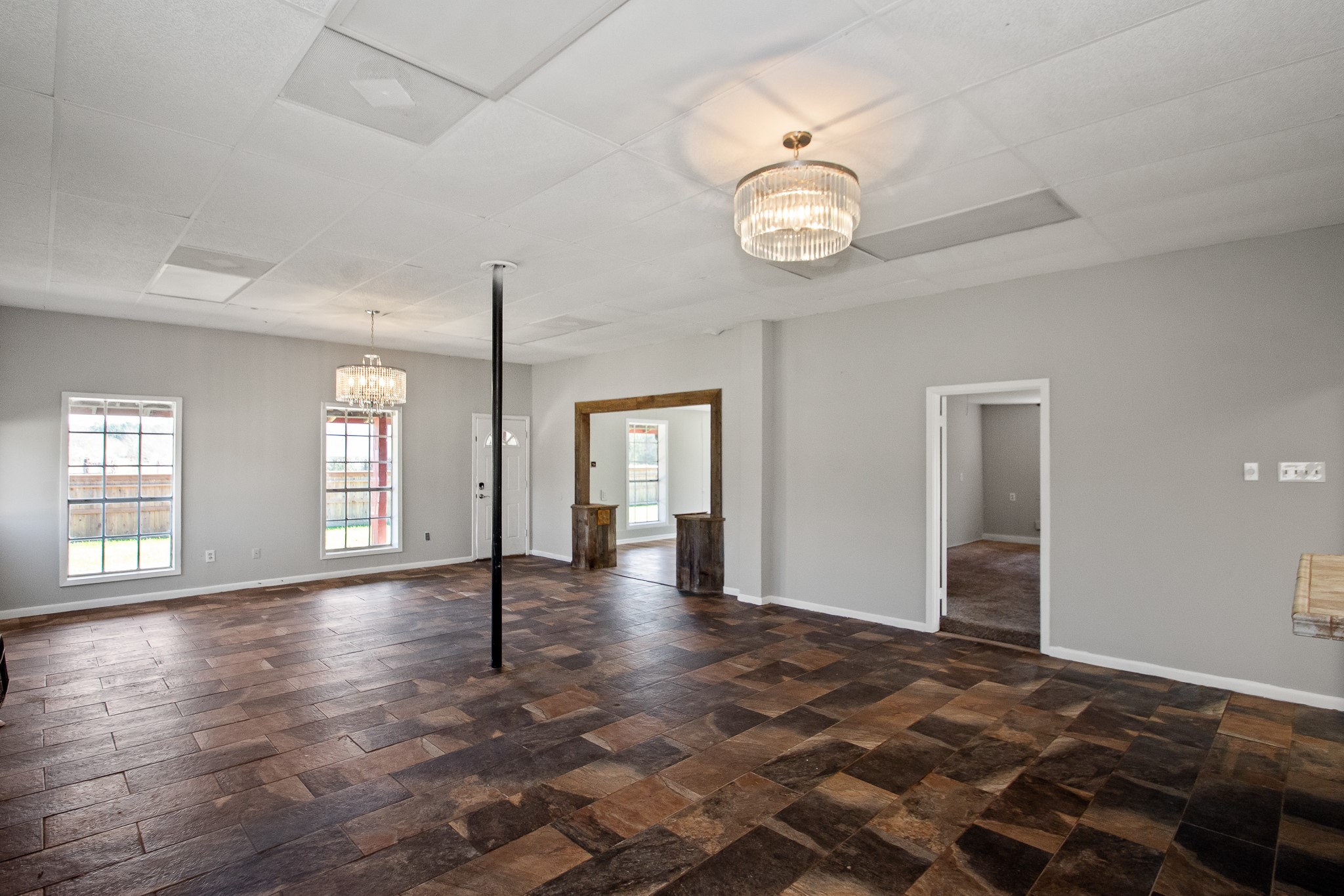 6830 South Highway 35 Alvin, TX 77511 - Photo 20 of 24 an empty room with wooden floor and windows
