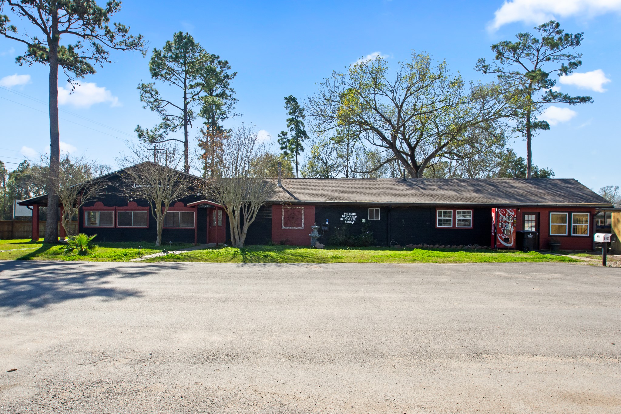 6830 South Highway 35 Alvin, TX 77511 - Photo 2 of 24 a house that has a tree in front of it
