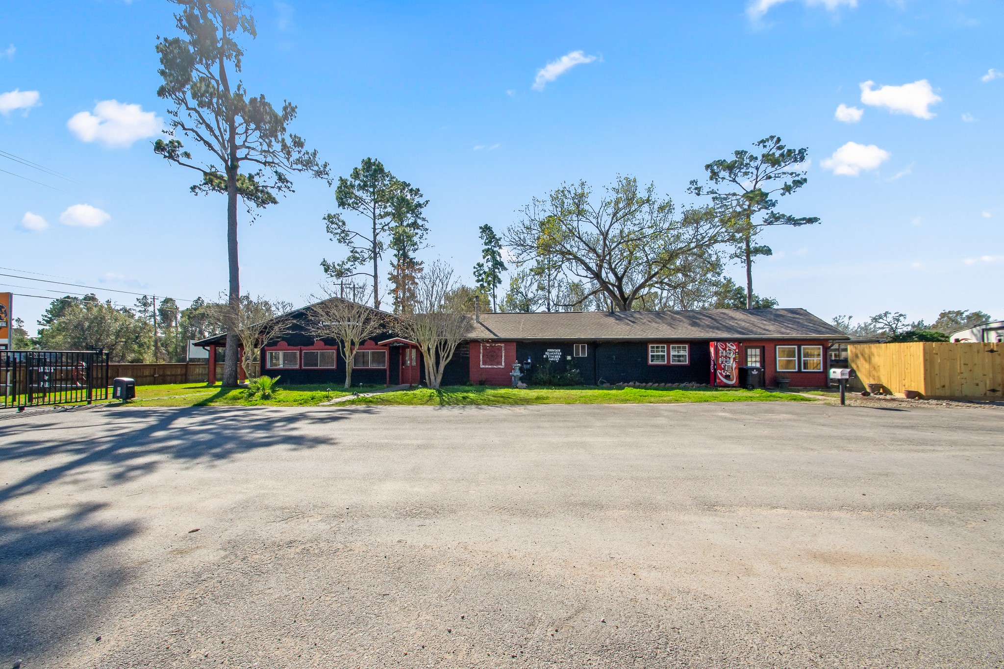 6830 South Highway 35 Alvin, TX 77511 - Photo 21 of 24 a view of a swimming pool with a yard and palm trees