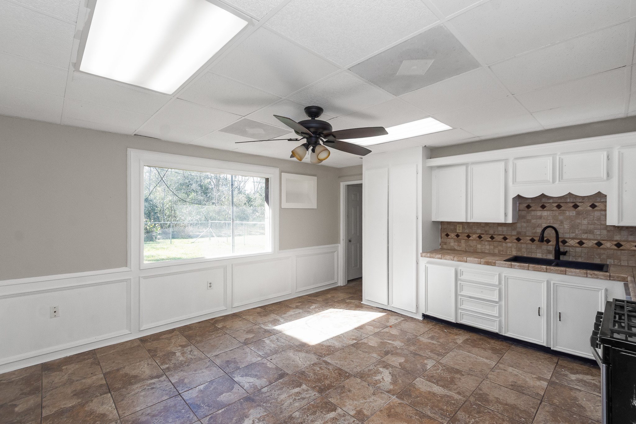 6830 South Highway 35 Alvin, TX 77511 - Photo 3 of 24 a view of a kitchen with a sink and a window